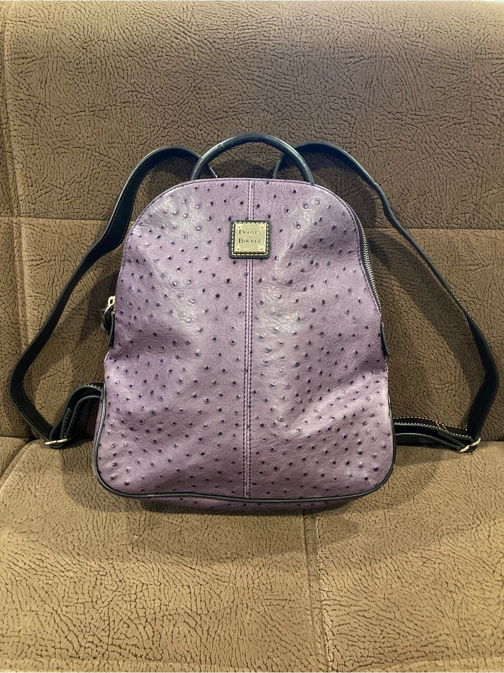 Dooney & Bourke Purple Ostrich Embossed Leather Backpack Gold tone plaque